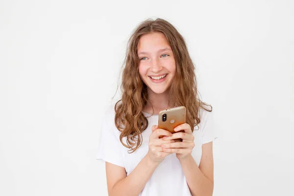Surprised Young Girl Using Mobile Phone Positive Expression Smiles Broadly — Stock Photo, Image