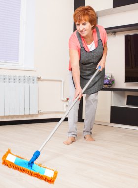 Woman cleaning the floor clipart