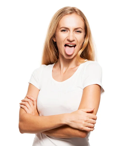 Frau zeigt Zunge — Stockfoto