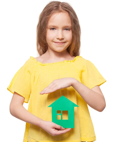 Girl holding a green house — Stock Photo, Image