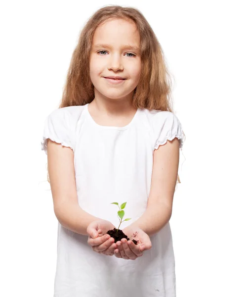 Child holding a sleedling — Stock Photo, Image