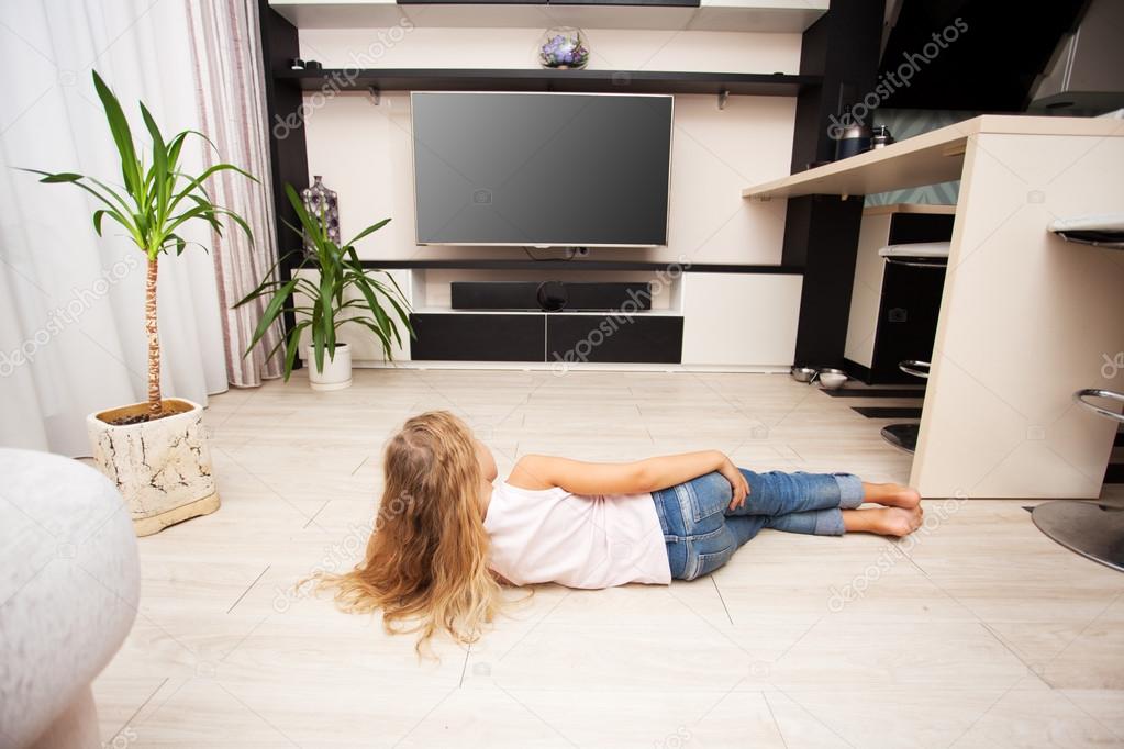 Child watching TV at home