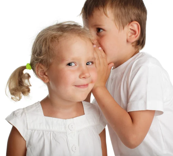 Boy whispers a secret Royalty Free Stock Images