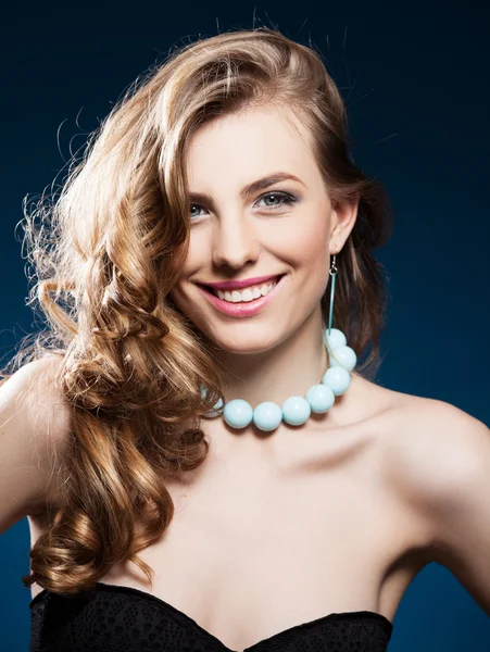 Beautiful woman with long curly brown hair — Stock Photo, Image