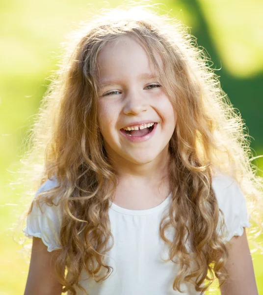 Laughing girl on grass — Stock Photo, Image