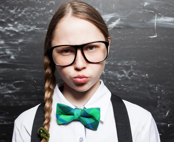 Girl near blackboard — Stock Photo, Image