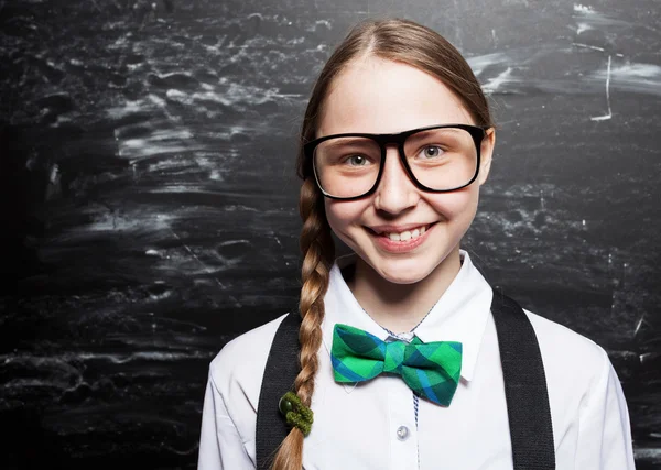 Girl near blackboard — Stock Photo, Image