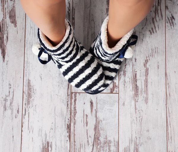 Warm slippers on the background floor — Stock Photo, Image