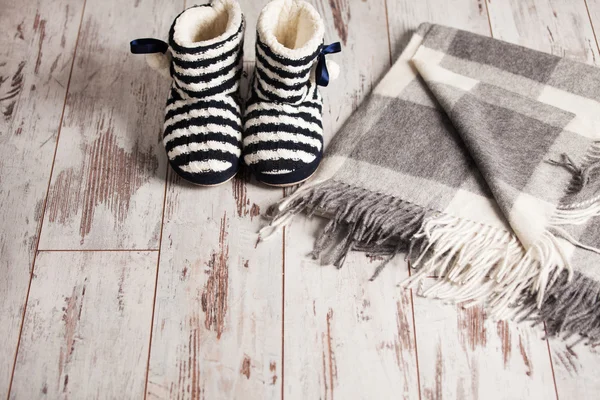 Warm slippers on the background floor — Stock Photo, Image