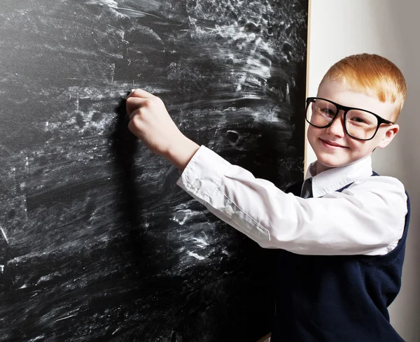 Boy near blackboard — Stock Photo, Image