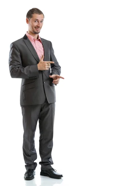 Largura completa traje corbata hombre de negocios señalando —  Fotos de Stock