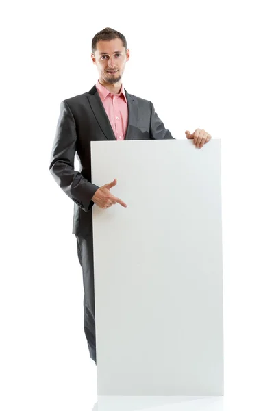 Engravatado homem de negócios exibindo cartaz — Fotografia de Stock