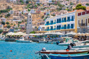 SYMI ISLAND, GREECE - JULY 5, 2015: View to waterfront harbour and main town on the island