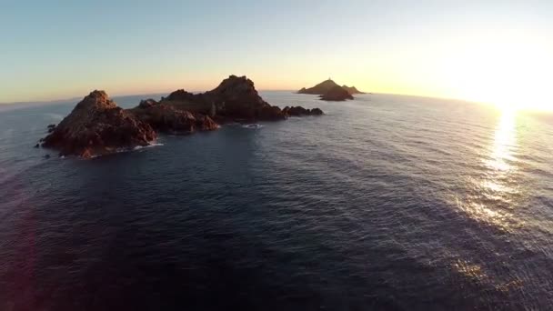 Flight over the sea and islands at sunset, Ajaccio area, Corsica, France. Archipel des Sanguinaires. Aerial panoramic view. — Stock Video