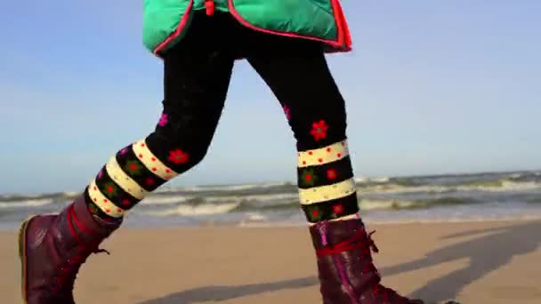 Little girl walks along shore of Baltic Sea — Stock Video