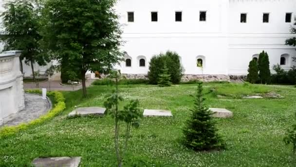 Church of St. Zosima and Savvatiy, Solovetsky miracle workers, located in north-west corner of monastery. Is housed the monastery hospital. Trinity Lavra of St. Sergius in Sergiev Posad, Russia. — Stock Video