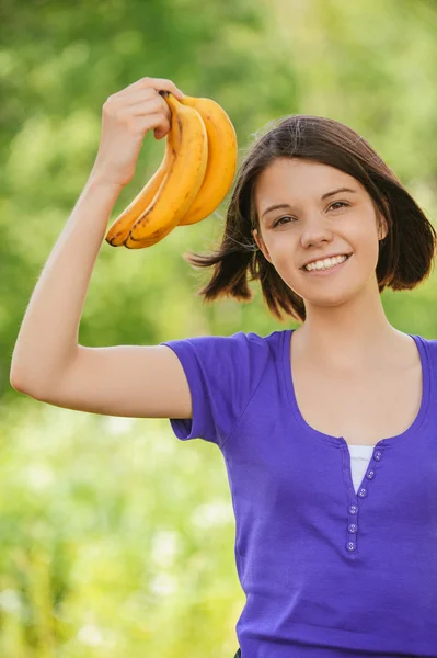 Beautiful woman bunch bananas hand — Stock Photo, Image