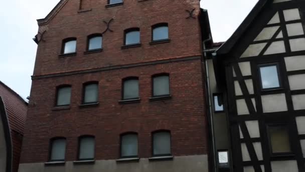 Old building of red brick. Bydgoszcz (Bromberg, Bydgostia) is a city located in northern Poland, on the Brda and Vistula rivers. — Stock Video