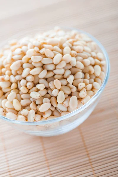 Glass Bowl Shelled Pine Nuts Bamboo Table Cloth — Stock Photo, Image