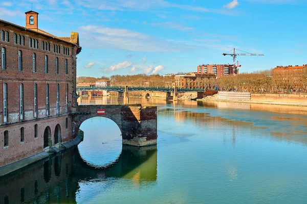 Remains of covered bridge of Daurade, built from 1141 to 1179 (still visible, since New Bridge) in Toulouse, France. Museum of History of Medicine is located in Hotel Assezat.