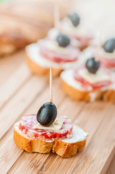 Sausage Sandwiches Cheese Olives Toothpick Wooden Table Background — Stock Photo, Image