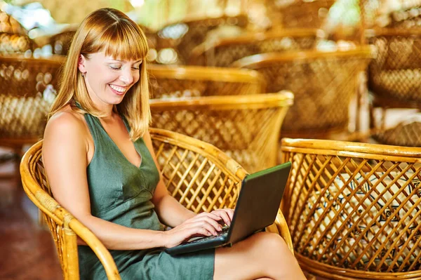 Young Beautiful Woman Green Dress Sitting Wooden Wicker Chair Works — Stock Photo, Image