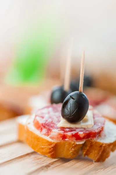 Sausage Sandwiches Cheese Olives Toothpick Wooden Table Background Stock Photo