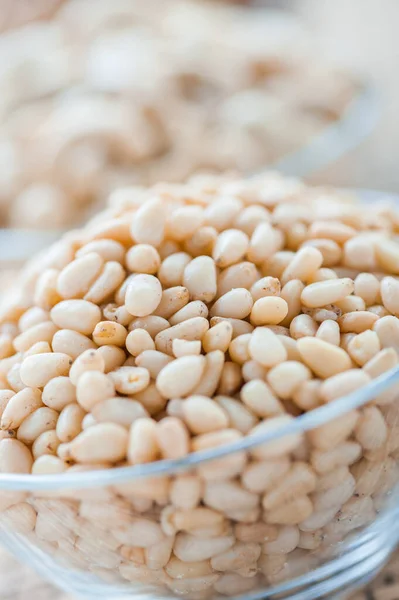 Glass Bowl Pine Nuts Bamboo Table Cloth — Stock Photo, Image