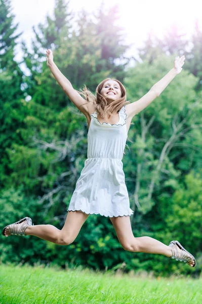 Young Charming Laughing Woman Long Hair White Dress Jumps Grass — Stock Photo, Image