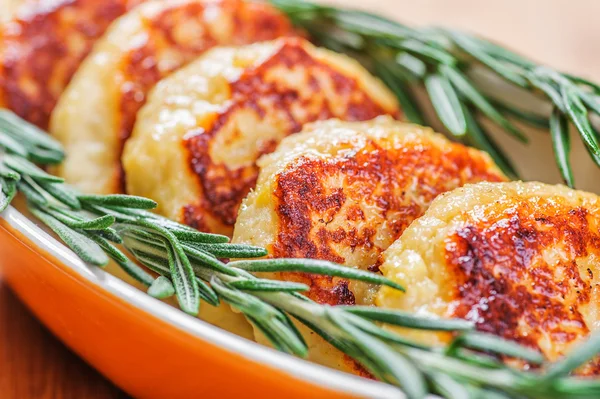 Cutlets and rosemary — Stock Photo, Image
