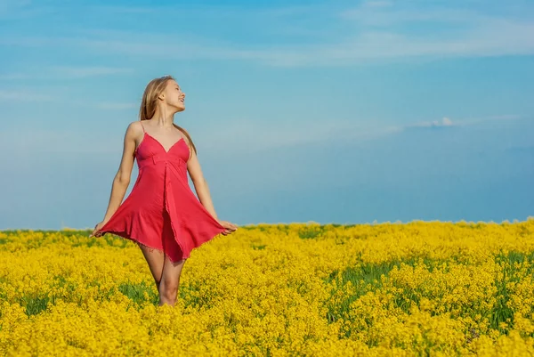 Beautiful cheerful woman spring field — Stock Photo, Image