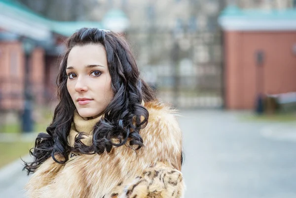 Girl in fur coat — Stock Photo, Image