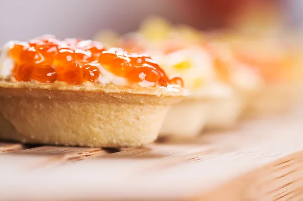 Tartlets with caviar and corn — Stock Photo, Image