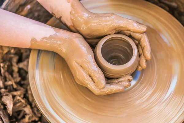 Hands of young potter — Stock Photo, Image