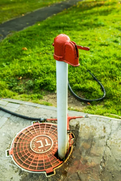 Red and white standpipe — Stock Photo, Image