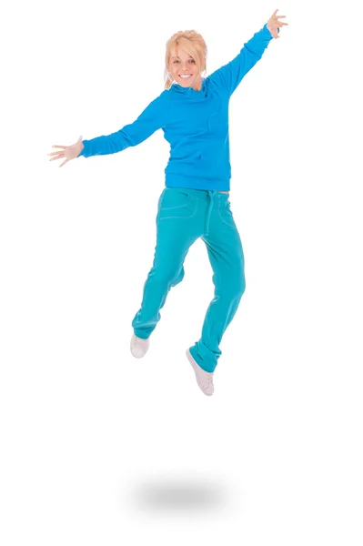 Young woman in blue dress jumping — Stock Photo, Image