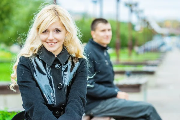 Beautiful beloved couple sitting — Stock Photo, Image