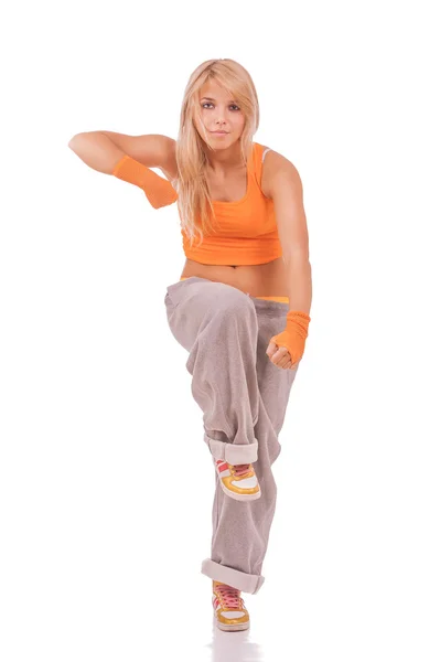 Kvinna i orange kläder gör fitness — Stockfoto