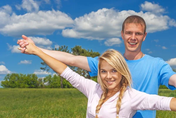 The girl embraces favourite behind Stock Photo