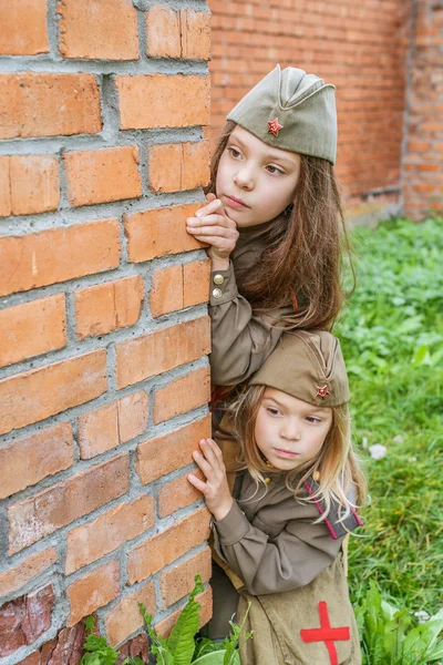 Small girls in Soviet military uniforms — Stock Photo, Image