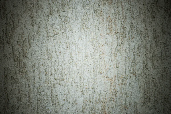 Wall with cracked plaster and dumps — Stock Photo, Image