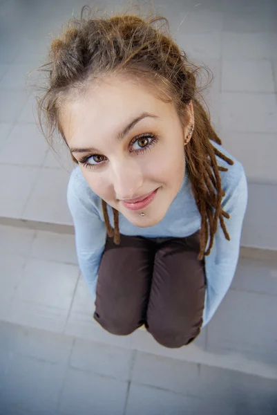 Girl with dreadlocks at steps — Stock Photo, Image