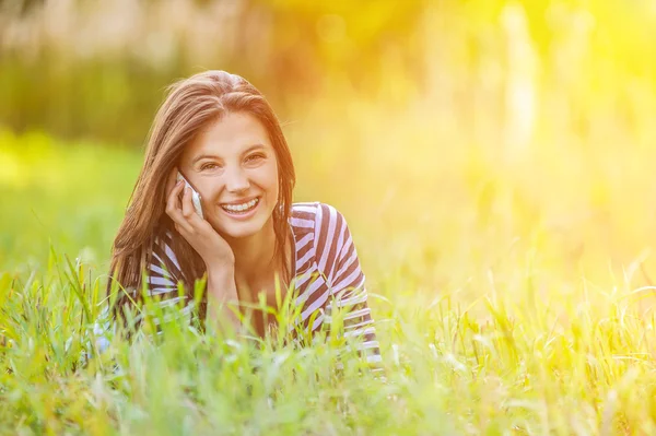 Young woman grass lying — Stock Photo, Image