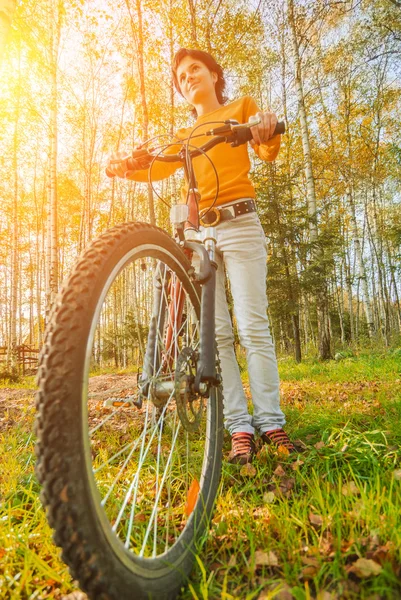 Beautiful girl riding bicycle — Stock Photo, Image