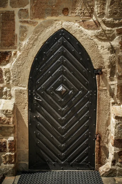 Metal door in an ancient fortress Stock Photo