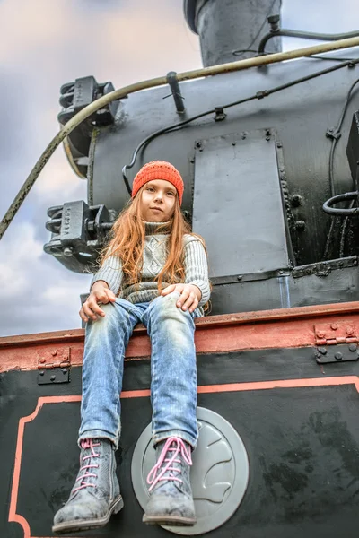 Little girl on railway locomotive — Stock Photo, Image