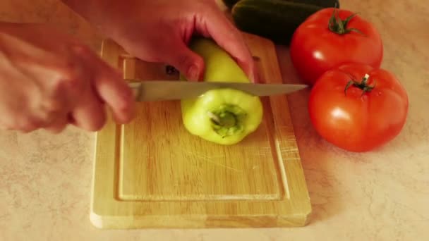 Woman with knife cuts pepper — 图库视频影像