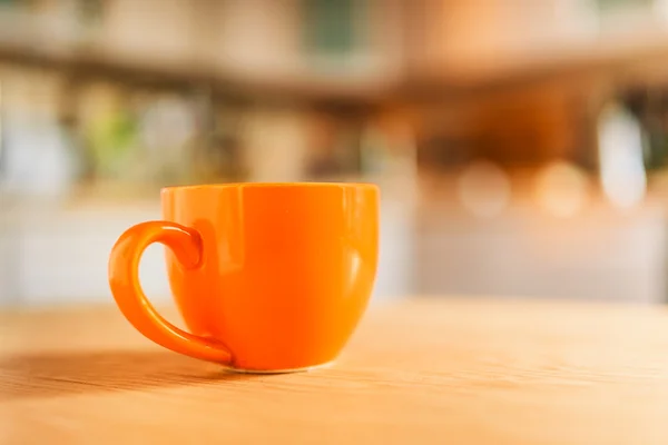 Orangefarbene Tasse — Stockfoto