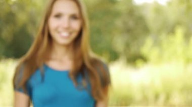 Young beautiful woman with kiwi