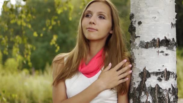 Beautiful woman near birch — Stock Video